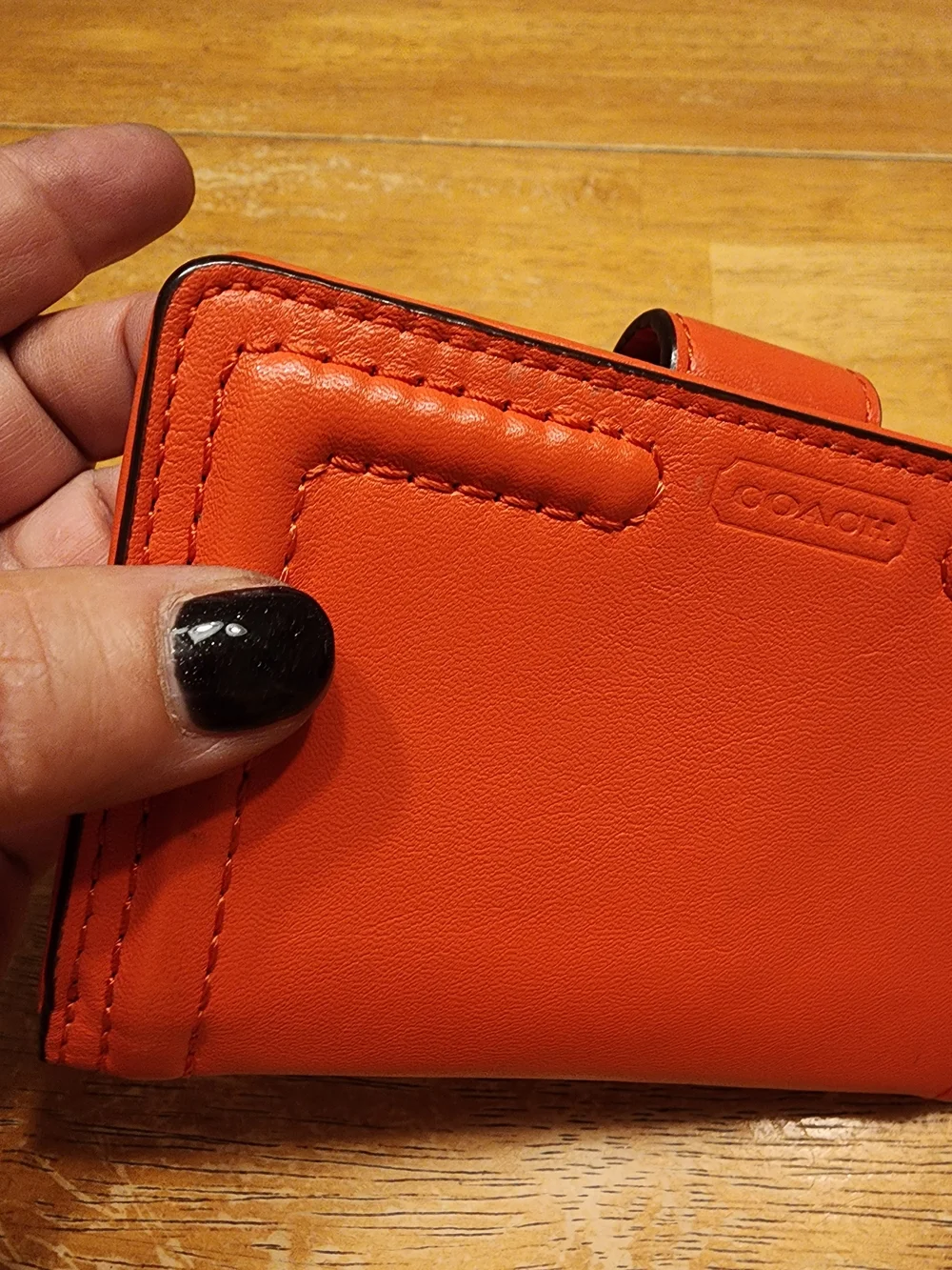 Coach Campbell Leather Buckle Medium Wallet in a vibrant orange shade with brass